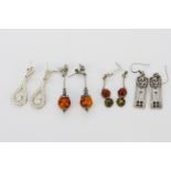 Four pairs of 925 silver drop earrings, largest L. 3cm. One back missing.