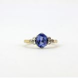 A yellow metal (tested high carat gold) ring set with a large oval cut sapphire, approx. 1.50ct, and