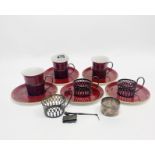 A part set of Shelley porcelain coffee cups and saucers with hallmarked silver cup saucers, with a