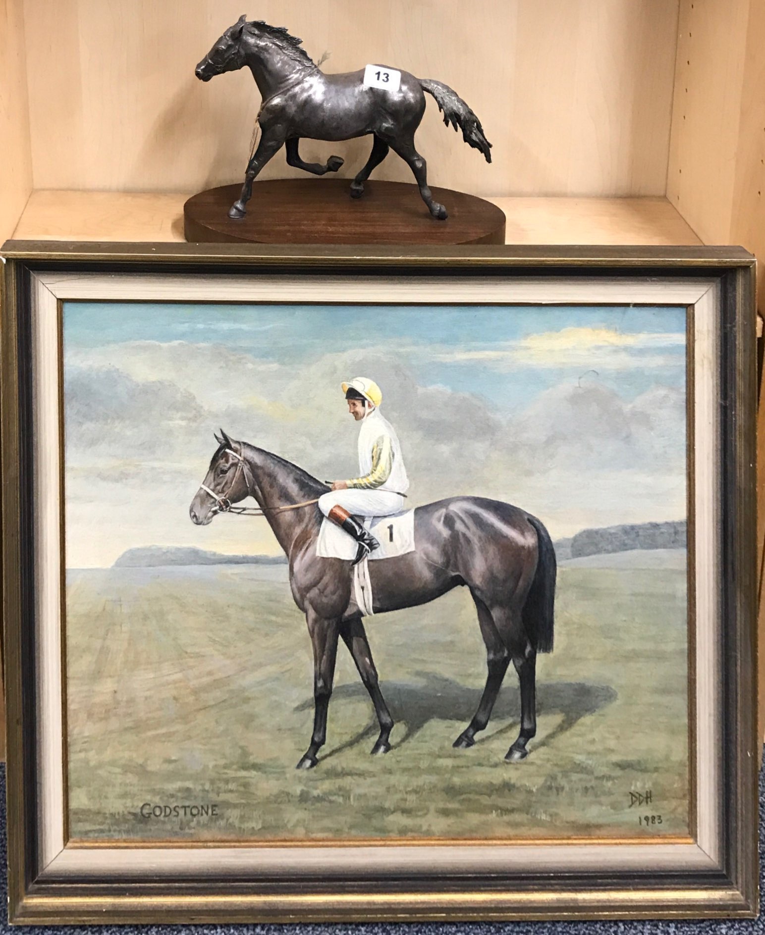 A hallmarked silver model of a racehorse, presented to 'Godstone' at Goodwood 1983, mounted on a