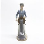 A large Lladro porcelain figurine of a young sailor, H. 33cm. (A/F).