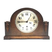 A 1930's chiming oak veneered mantel clock, H. 22cm.