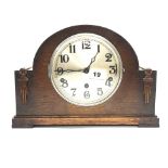 A 1930's chiming oak veneered mantel clock, H. 22cm.