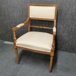 A cream upholstered Regency style beechwood armchair, H. 88cm.