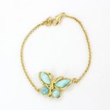 A 925 silver gilt butterfly bracelet set with cabochon cut larimar, L. 18.5cm.