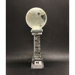 A Chinese etched crystal ball globe on an etched crystal stand, H. 32cm.