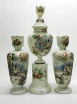 A large 19th century three piece garniture of hand painted pale green opaline glass vases,