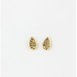 A pair of 18ct yellow gold diamond set teardrop shaped stud earrings, L. 0.7cm.