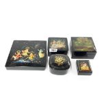 A group of five Russian hand painted laquer boxes, largest 19 x 19 x 3.5cm.