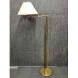 A gilt metal rotating standard lamp with, overall H. 140cm.