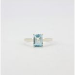 A 925 silver ring set with an emerald cut aquamarine, (N).