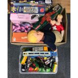 A box of die cast model vehicles, with a quantity of games and other toys.