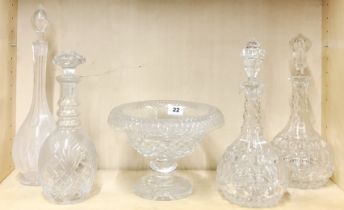 A 19th century cut crystal fruit bowl with four cut glass decanters, one decanter A/F to rim.