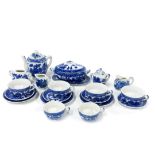 A miniature porcelain willow pattern tea and dinner set, teapot H. 8cm.