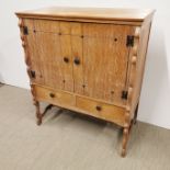 A light oak cabinet, 108 x 94 x 48cm.