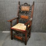 An 18th century Italian carved armchair with three inlaid panels, H. 123cm.