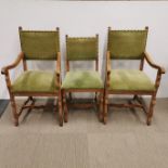 A set of six 1920's light oak green upholstered dining chairs.