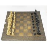 A Canterbury Tales resin chess set and board, king H. 12cm.