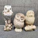 Three concrete garden figures of owls, largest H. 40cm.