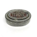 A rare English pewter box commemorating the maiden voyage of the RMS Titanic on April 10th 1912,