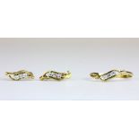 An 18ct yellow gold jewellery suite of diamond set earrings and matching ring, L. 1cm, (O).