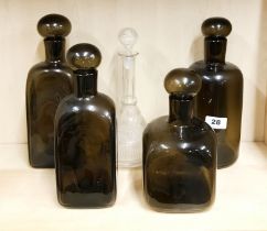 Four 1970's smoked glass bottles, tallest H. 28cm, together with a decanter.