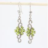 A pair of 925 silver drop earrings set with pear cut peridot and white stones, L. 3.7cm.