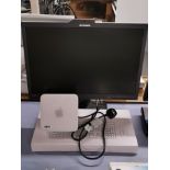 An Apple Mac Mini (model no. A1283) together with a Dell monitor, keyboard and mouse.