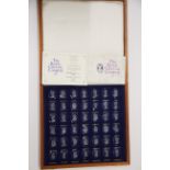 A cased set of royal crystal cameos by Danbury Mint