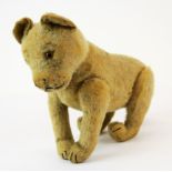 A mid 20th century Steiff articulated plush lion toy, L. 34cm.