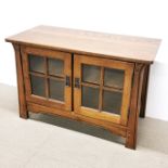 A Sherry two door oak cabinet, 102 x 48 x 68cm.