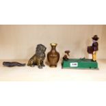 A cast iron money box, brass lion, nutcrackers and Chinese cloisonne vase.