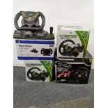 A group of five steering wheels for consoles.