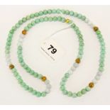A single strand necklace of mixed colour jade beads, necklace L. 78cm.