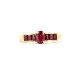 A hallmarked 9ct yellow gold ring set with rubies, (R.5).