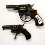 Two antique starting pistols.