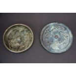 Two Chinese Ming dynasty style bronze hand mirrors, largest Dia. 13.5cm. Old collectors