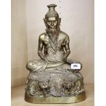 A large mid 20th century Eastern bronze/brass figure of a seated Deity, H. 40cm.