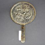 An early Chinese bronze hand mirror, L. 18cm. Jean Rich collection.