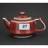 A Chinese sang de boeuf glazed porcelain teapot, spout to handle 16cm.