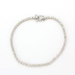 An 18ct white gold (stamped 18k) tennis bracelet set with brilliant cut diamonds, approx. 3ct total,