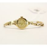 A lady's 9ct gold Enicar wristwatch and strap.