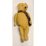 A large old English articulated teddy bear, H. 75cm.