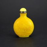 A Chinese carved imperial yellow Peking glass snuff bottle decorated with crickets and signed, H.