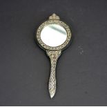 An Eastern silver decorated bronze hand mirror, H. 15.5cm. Jean Rich collection.