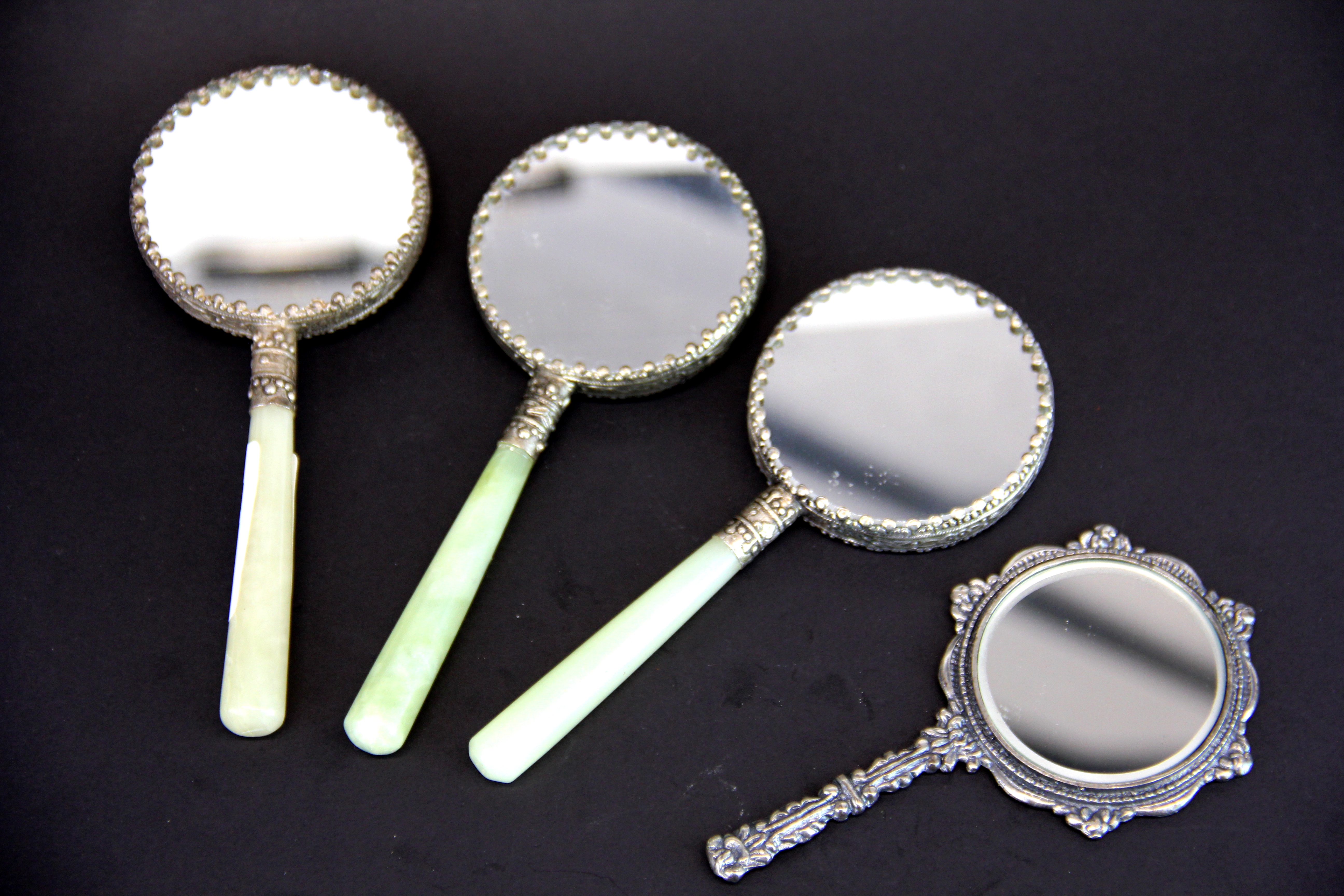 Three Chinese jade handled white metal and enamel hand mirrors, L. 15cm. with a further hand mirror. - Bild 2 aus 2