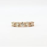 An 18ct rose gold ring set with five large brilliant cut diamonds, approx. 2.15ct total, (M).