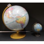 A Replogle world nations series vintage globe together with a smaller globe, large globe H. 38cm.