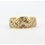 A hallmarked 9ct yellow gold (worn hallmark) ring set with aquamarine and blue stone, (U).