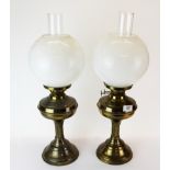 A pair of brass oil lamps, H. 55cm.